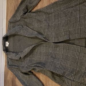 Women's blazer with  pockets and side slits on sides.  Very flattering. New.